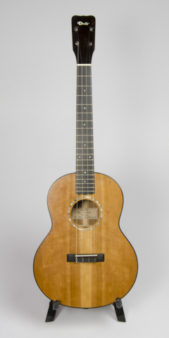 David Dart Cherry Baritone Ukulele, Style 2 (2015): Cherry top, sides, back & neck; ebony fingerboard, binding, bridge, & peghead overlay; abalone Dart logo, soundhole inlay, and fingerboard dots; sterling silver fingerboard side dots