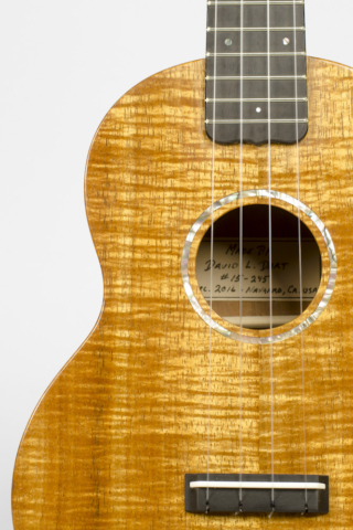 David Dart Koa Concert Ukulele, Style 1 (2016): curly koa top; one-piece koa back; koa neck; ebony fingerboard & bridge; abalone Dart logo (hand-cut), soundhole inlay (hand-cut), & fingerboard dots